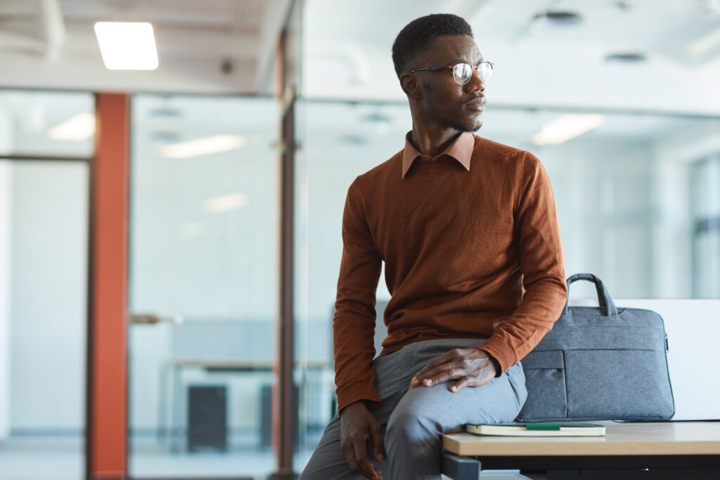 Contemporary African-American Man Looking Away in Office